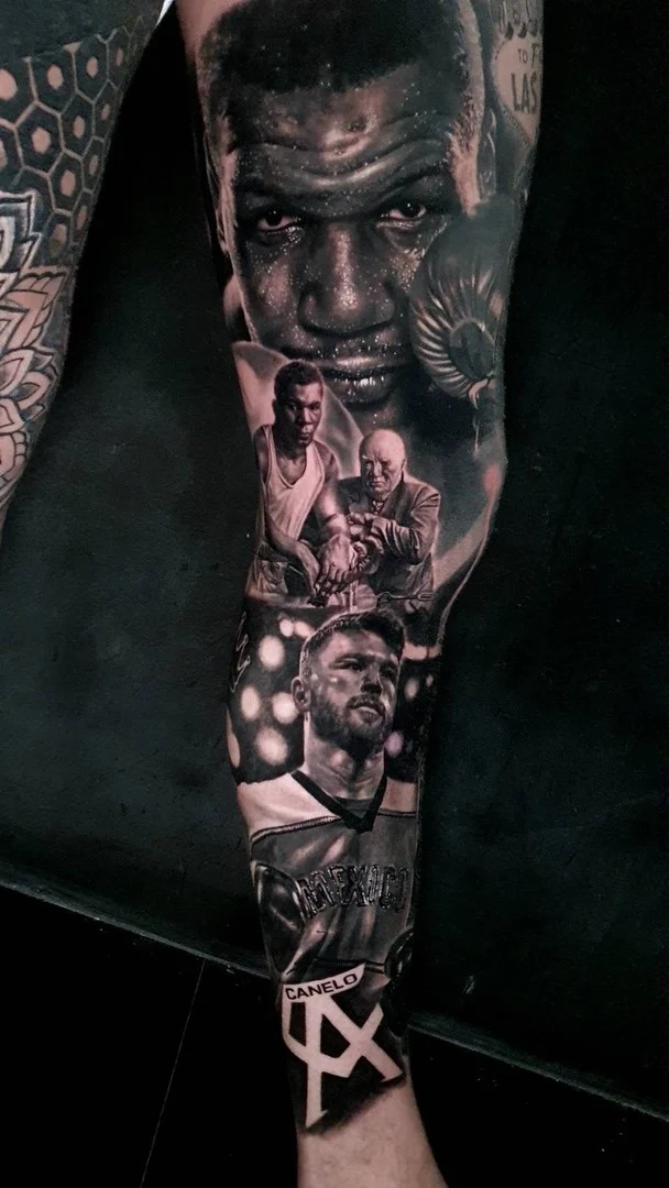 Black and grey portrait realism leg sleeve pairing Mike Tyson with Canelo Alvarez and Mexico robe lettering at Bloodline Tattoo Phuket.